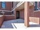 Private patio with brick wall and access from the home at 679 E 16Th St, Indianapolis, IN 46202