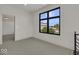 Bright bedroom with grey carpet and large window at 679 E 16Th St, Indianapolis, IN 46202