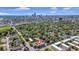 Aerial view showing home's location in a vibrant urban neighborhood with city skyline in the background at 679 E 16Th St, Indianapolis, IN 46202