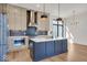 Modern kitchen with an island, stainless steel appliances, and hardwood floors at 679 E 16Th St, Indianapolis, IN 46202