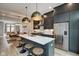 Modern kitchen with dark cabinetry, quartz countertops, and stainless steel appliances at 721 E 16Th St, Indianapolis, IN 46202
