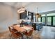 Modern kitchen with dark cabinetry, island, and stainless steel appliances at 721 E 16Th St, Indianapolis, IN 46202