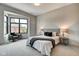 Spacious bedroom with large window, carpeted floor, and a seating area at 721 E 16Th St, Indianapolis, IN 46202