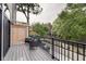 Private deck with wooden flooring and wicker furniture at 721 E 16Th St, Indianapolis, IN 46202