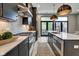 Modern kitchen with dark cabinetry, quartz countertops and island at 721 E 16Th St, Indianapolis, IN 46202