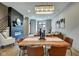 Elegant dining room features a live edge table and modern chandelier at 721 E 16Th St, Indianapolis, IN 46202
