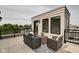 Private rooftop deck with seating area and city views at 721 E 16Th St, Indianapolis, IN 46202