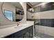 Contemporary bathroom with a frameless glass shower and dark vanity at 721 E 16Th St, Indianapolis, IN 46202