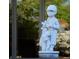 White golfer statue adds charm to the garden at 8494 W Mulligan Ln, Columbus, IN 47201