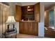 Built-in wet bar with wine storage and glass shelving at 8494 W Mulligan Ln, Columbus, IN 47201