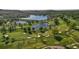 Aerial view of a golf course with lake at 8494 W Mulligan Ln, Columbus, IN 47201