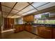 Modern kitchen with granite countertops and wood cabinets at 8494 W Mulligan Ln, Columbus, IN 47201