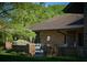 Brick patio with seating area and landscape lighting at 8494 W Mulligan Ln, Columbus, IN 47201
