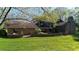 Brick house with patio, landscaping and large backyard at 8494 W Mulligan Ln, Columbus, IN 47201