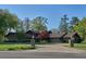 Brick house with a circular driveway and landscaping at 8494 W Mulligan Ln, Columbus, IN 47201