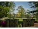 Relaxing patio furniture overlooks a lush green golf course at 8494 W Mulligan Ln, Columbus, IN 47201