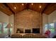 Living room with brick fireplace and wood paneled ceiling at 8494 W Mulligan Ln, Columbus, IN 47201