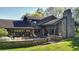Brick house with patio, landscaping, and large backyard at 8494 W Mulligan Ln, Columbus, IN 47201