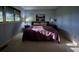Bright bedroom with a queen-size bed and ample natural light at 8494 W Mulligan Ln, Columbus, IN 47201