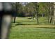 Green with sand traps and flag in view at 8494 W Mulligan Ln, Columbus, IN 47201