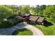 Ranch-style home with a circular driveway and large yard at 8494 W Mulligan Ln, Columbus, IN 47201