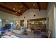 Bright dining area with wood-paneled walls and kitchen views at 8494 W Mulligan Ln, Columbus, IN 47201