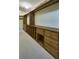 Large walk-in closet with custom built-in shelving and drawers at 8494 W Mulligan Ln, Columbus, IN 47201