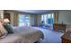 Main bedroom with patio access and ample natural light at 8494 W Mulligan Ln, Columbus, IN 47201