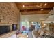 Living room with brick fireplace and vaulted ceiling at 8494 W Mulligan Ln, Columbus, IN 47201