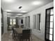 Modern dining room with a large wooden table and statement lighting at 723 N Cleveland St, Indianapolis, IN 46202
