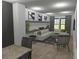 Spacious living room with built-in shelving and large windows at 723 N Cleveland St, Indianapolis, IN 46202