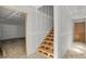 Unfinished wooden staircase in a house under construction, connecting floors at 723 N Cleveland St, Indianapolis, IN 46202