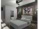 Bright bedroom with brick accent wall and en-suite bathroom at 723 N Cleveland St, Indianapolis, IN 46202
