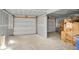 Unfinished garage interior with drywall and a large door at 723 N Cleveland St, Indianapolis, IN 46202