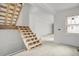 Image shows an interior of a house under construction with unfinished walls and stairs at 723 N Cleveland St, Indianapolis, IN 46202
