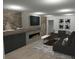 Finished basement with fireplace, sectional sofa, and media console at 723 N Cleveland St, Indianapolis, IN 46202