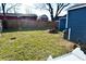 Backyard with grass, shed, and various yard tools at 1431 E Pleasant Run Parkway South Dr, Indianapolis, IN 46203