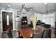 Bright dining area with wood table, leather chairs, and a chandelier at 1431 E Pleasant Run Parkway South Dr, Indianapolis, IN 46203