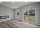 Bright living room with hardwood floors and sliding glass doors to a deck at 4541 Pennsy Way, Brownsburg, IN 46112