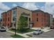 Modern brick townhouses with private balconies and street parking at 82 E Wayne St # C, Franklin, IN 46131