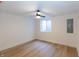 Bright basement bedroom with wood-look floors and a ceiling fan at 2133 N Talbott St, Indianapolis, IN 46202