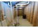 Unfinished basement showing plumbing and mechanicals at 2133 N Talbott St, Indianapolis, IN 46202