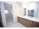 Elegant bathroom featuring double vanity and a large walk-in shower at 2133 N Talbott St, Indianapolis, IN 46202