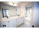 Bathroom with double vanity, white cabinets, and black accents at 2133 N Talbott St, Indianapolis, IN 46202