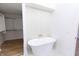 Spa-like bathroom with a freestanding tub and walk-in closet at 2133 N Talbott St, Indianapolis, IN 46202