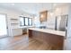 Open concept kitchen with island and stainless steel appliances at 2133 N Talbott St, Indianapolis, IN 46202
