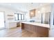 Open concept kitchen with island and stainless steel appliances at 2133 N Talbott St, Indianapolis, IN 46202