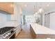 Modern kitchen with stainless steel appliances and large island at 2133 N Talbott St, Indianapolis, IN 46202