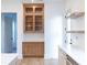 Butlers pantry with glass-front cabinets and quartz countertop at 2133 N Talbott St, Indianapolis, IN 46202