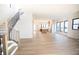 Spacious living room with hardwood floors and open staircase at 2133 N Talbott St, Indianapolis, IN 46202